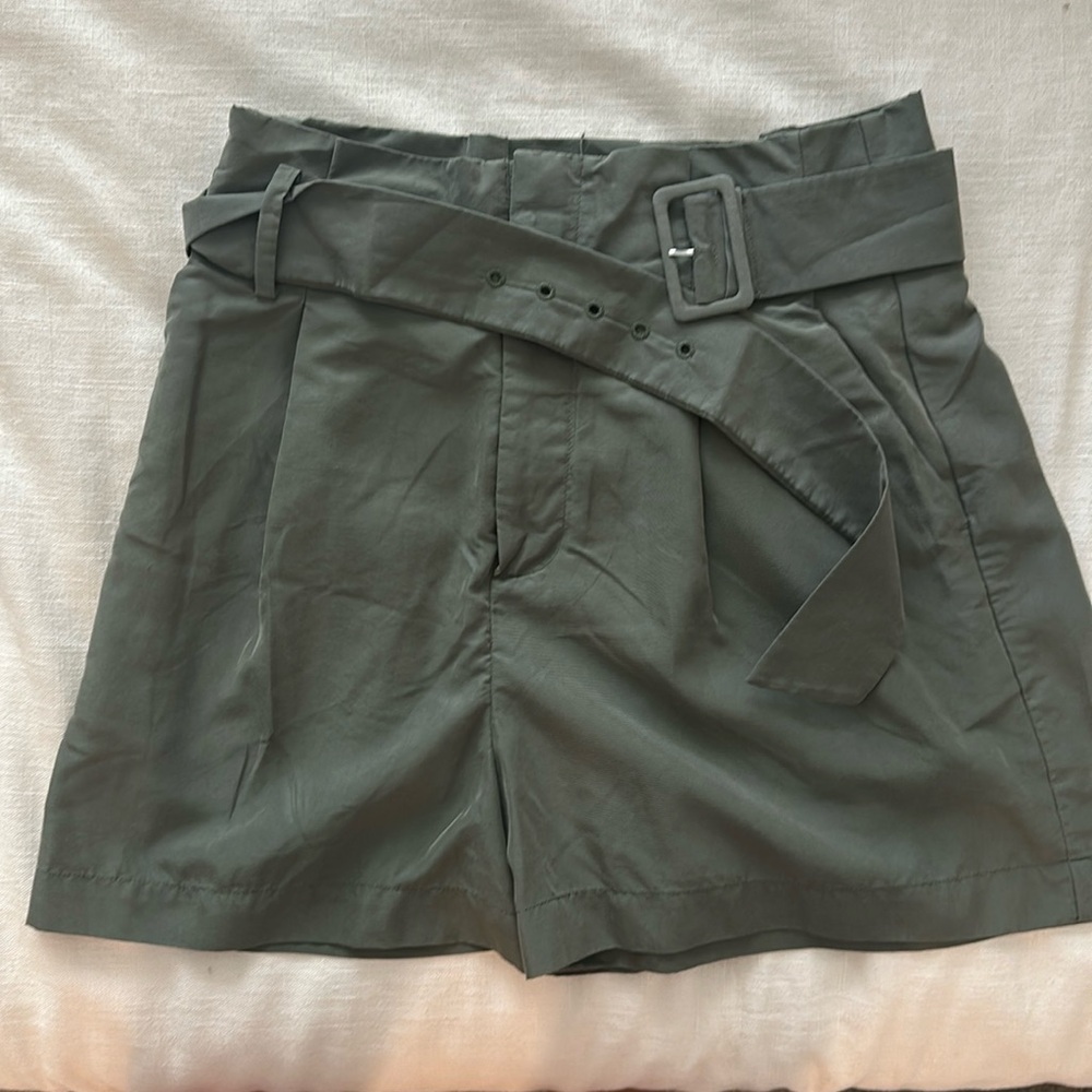 High waisted, dark green shorts